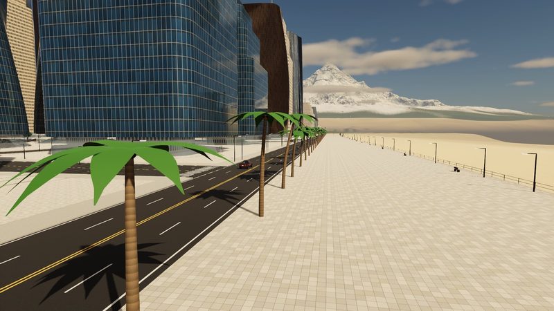 Palm-lined beachfront promenade beside the towers, a snowy mountain at the end of the road