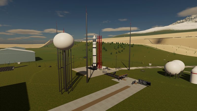 Rocket standing on its launch pad, with spherical tanks and a water tower around the pad